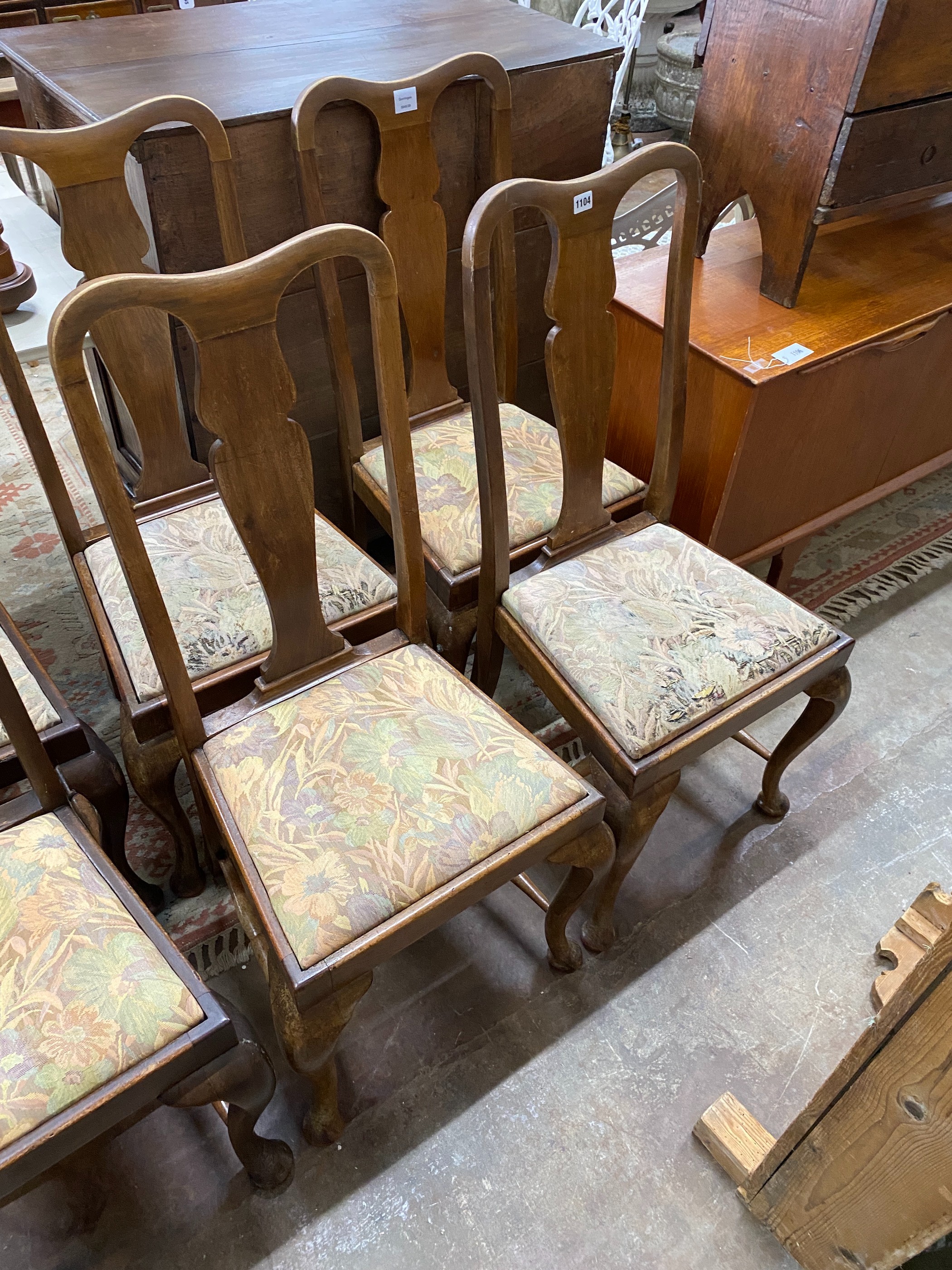 A set of eight early 20th century Queen Anne style mahogany dining chairs, one with arms